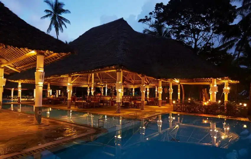 Neptune Village Beach Resort Diani — tropical garden pool and beach access
